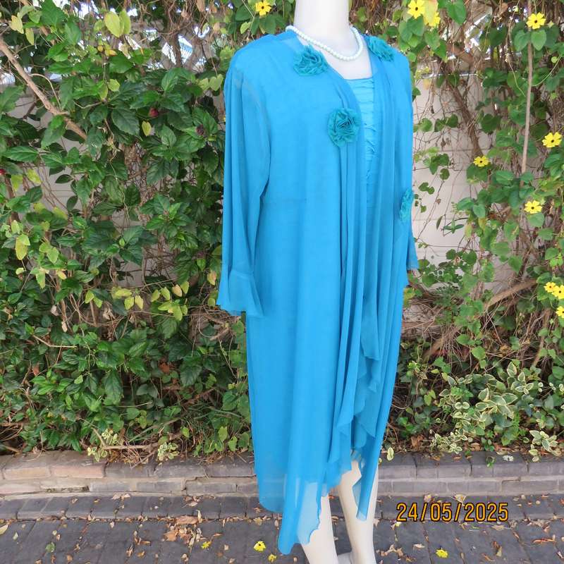 Jade colour sleeveless dress with sheer polyester coat. Boutique made size 40.