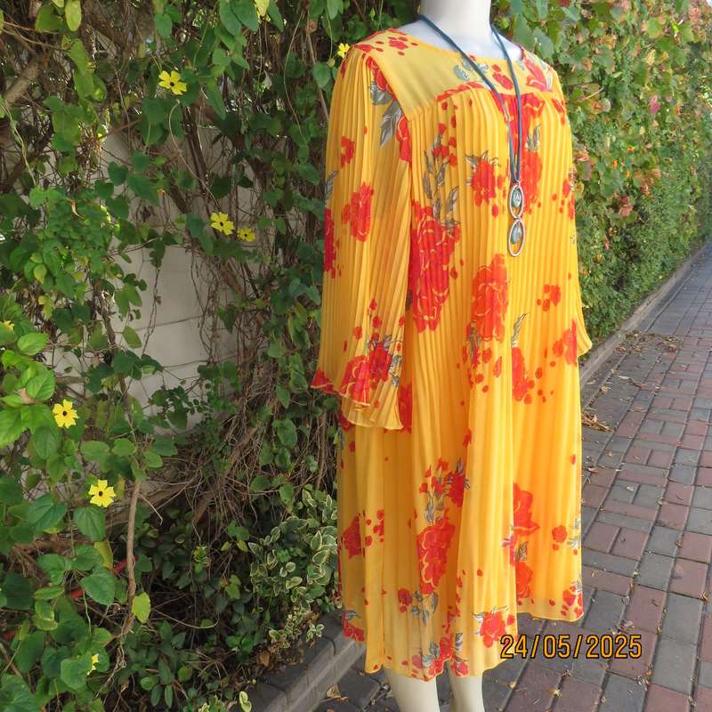 JUDY'S PRIDE vibrant orange slip over permanent pleated lined dress. Crimson flowers. Size 40