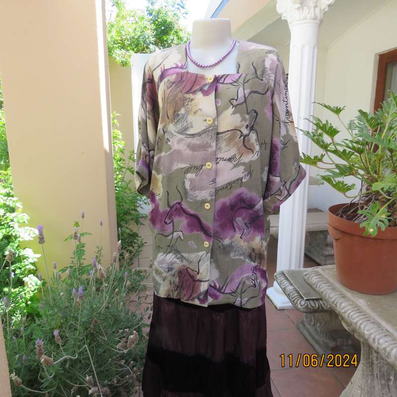 AVANT GARDE uniquely  styled size 36 button down top from Greece. With black animal drawings.As new