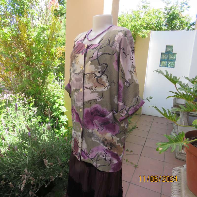 AVANT GARDE uniquely  styled size 36 button down top from Greece. With black animal drawings.As new