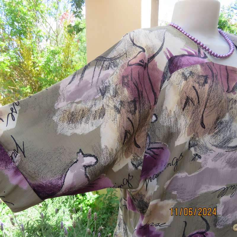 AVANT GARDE uniquely  styled size 36 button down top from Greece. With black animal drawings.As new