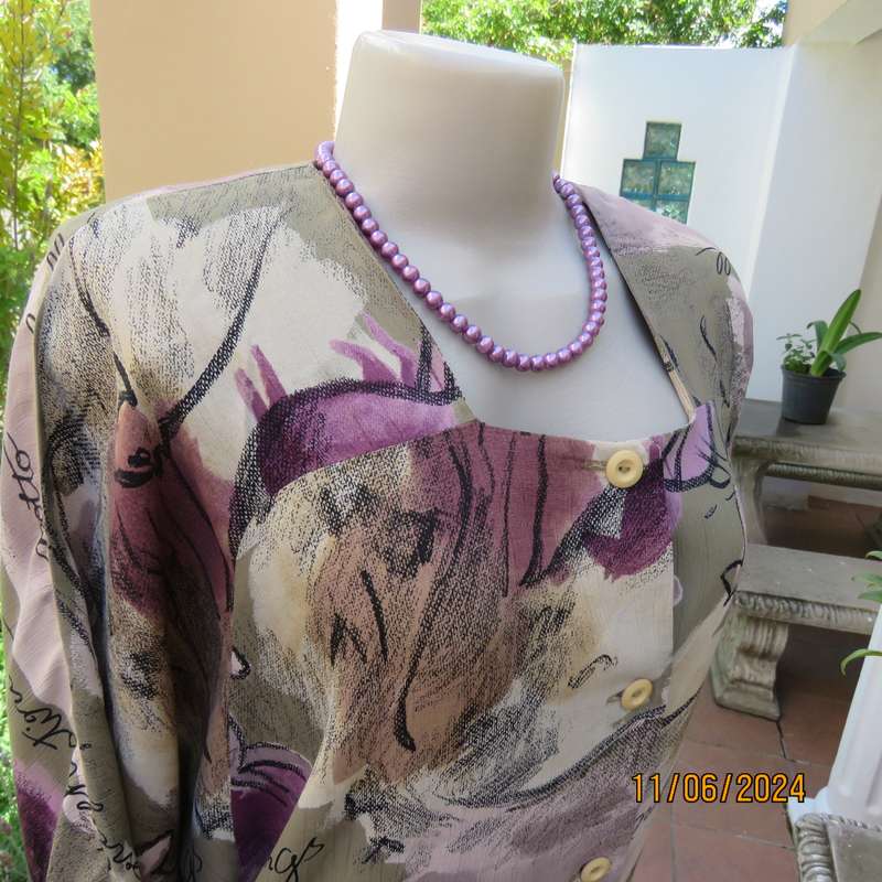 AVANT GARDE uniquely  styled size 36 button down top from Greece. With black animal drawings.As new