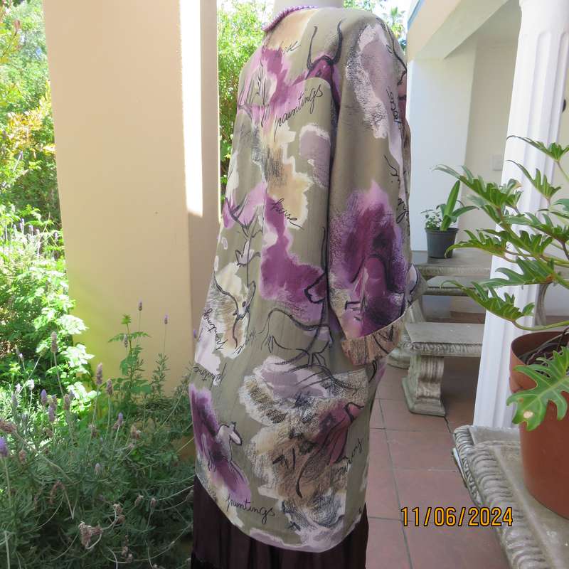 AVANT GARDE uniquely  styled size 36 button down top from Greece. With black animal drawings.As new