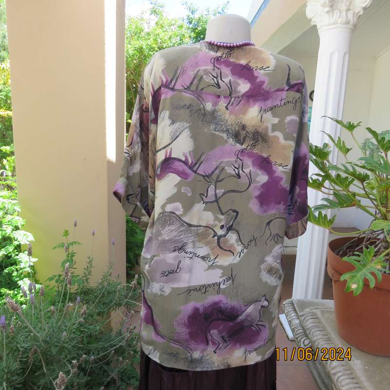 AVANT GARDE uniquely  styled size 36 button down top from Greece. With black animal drawings.As new
