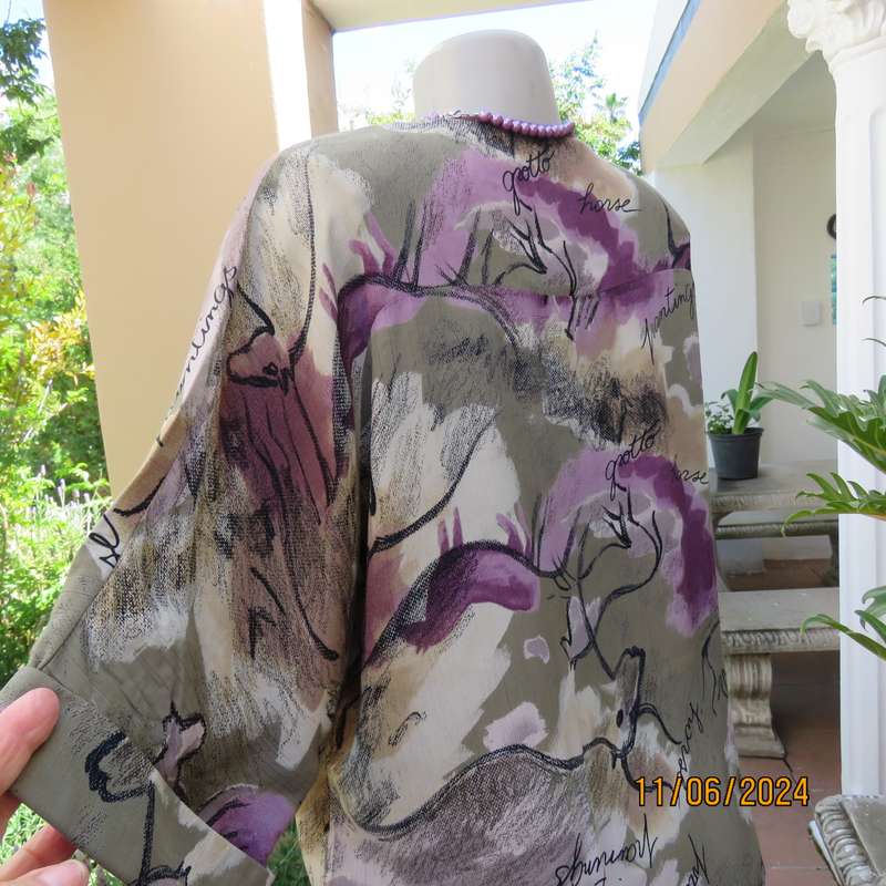 AVANT GARDE uniquely  styled size 36 button down top from Greece. With black animal drawings.As new