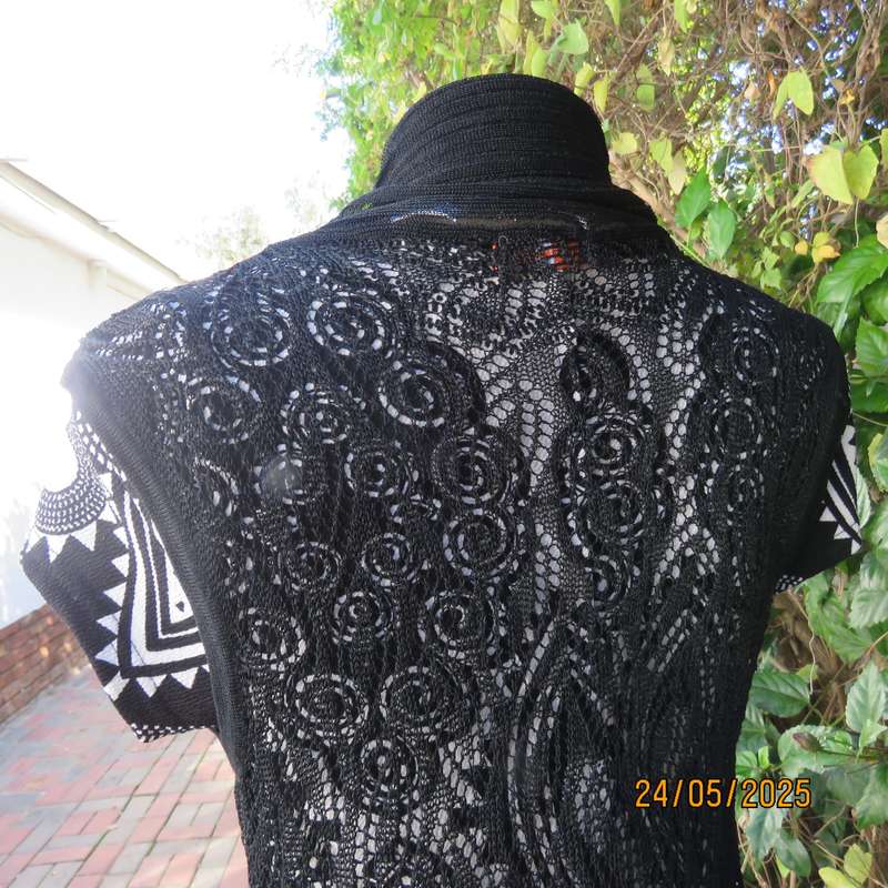 Black acrylic knit lace stitch sleeveless waterfall style cover up. Size 32.