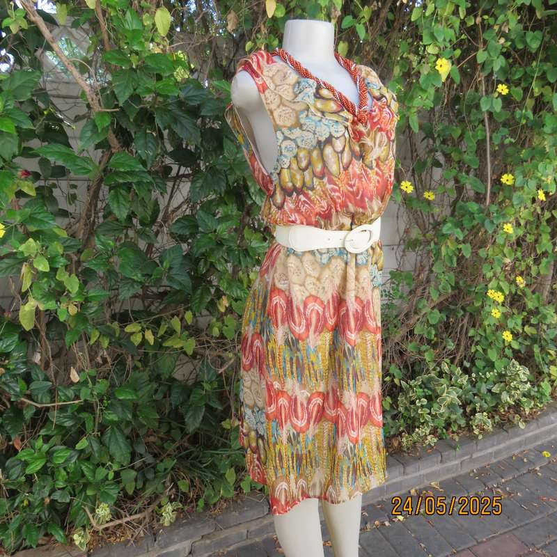 Cool colourful sleeveless dress with frilled V neckline. Size 37. Lined. Elasticated waist.