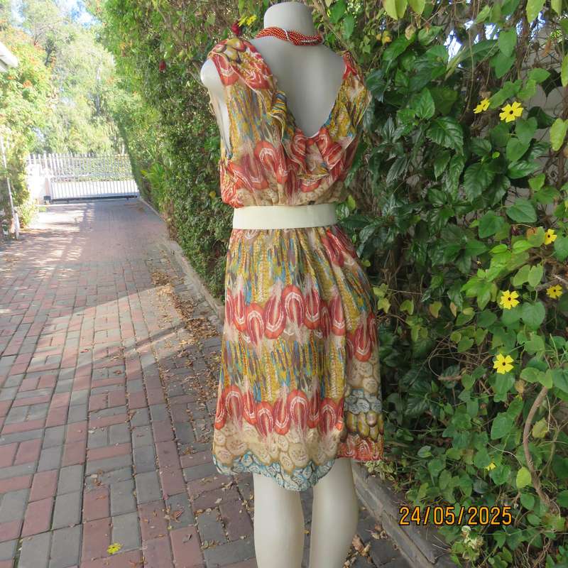 Cool colourful sleeveless dress with frilled V neckline. Size 37. Lined. Elasticated waist.