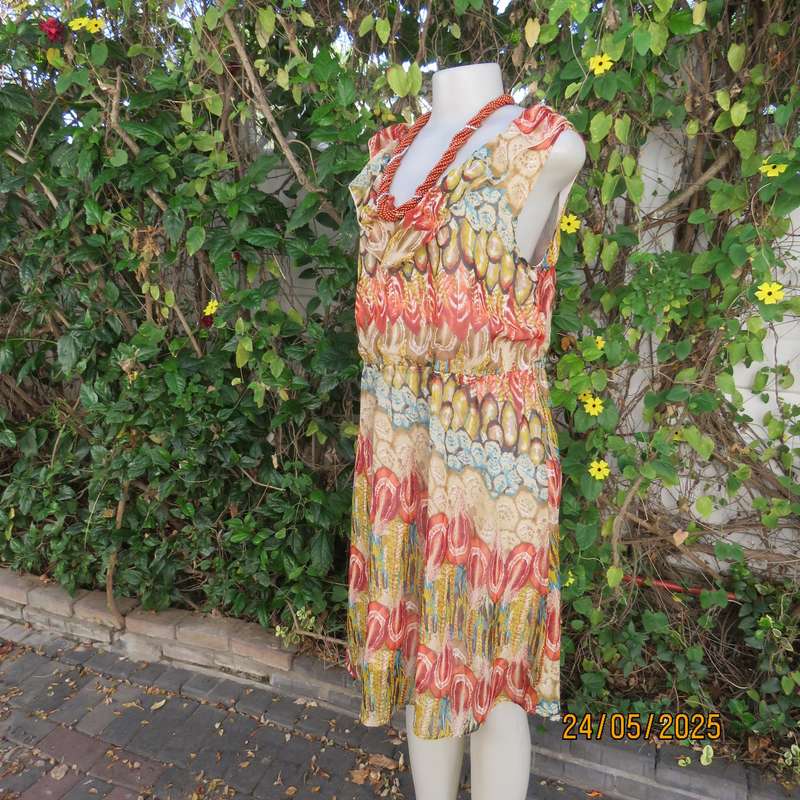 Cool colourful sleeveless dress with frilled V neckline. Size 37. Lined. Elasticated waist.