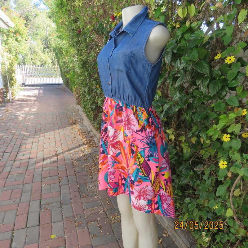 Casual dress with blue denim top and bright floral polyester high-low skirt. Size 34