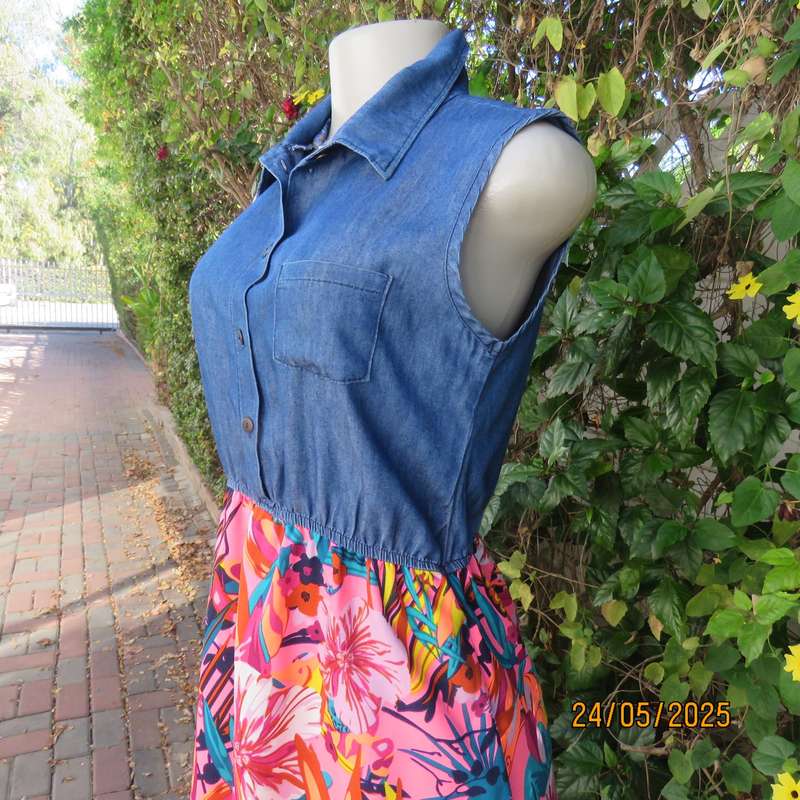 Casual dress with blue denim top and bright floral polyester high-low skirt. Size 34