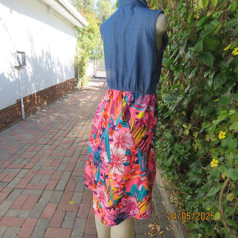 Casual dress with blue denim top and bright floral polyester high-low skirt. Size 34