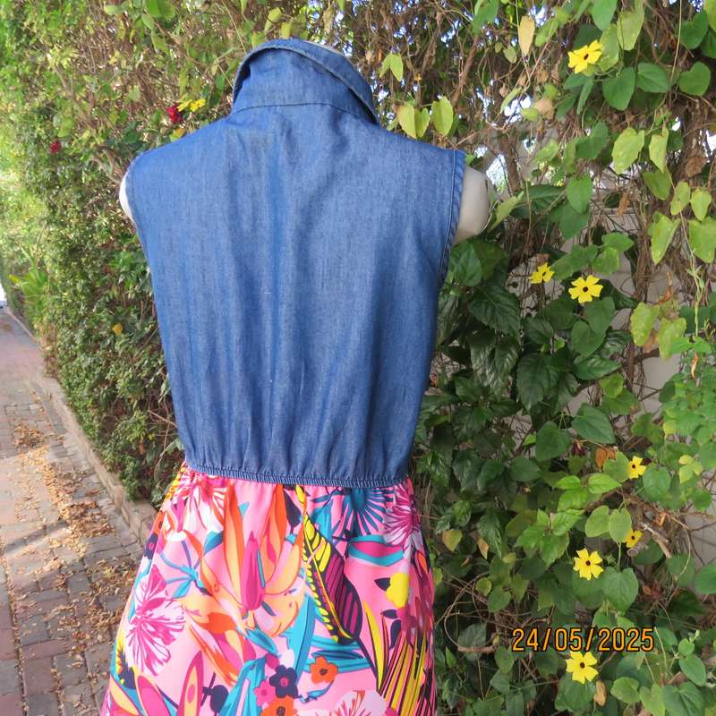 Casual dress with blue denim top and bright floral polyester high-low skirt. Size 34