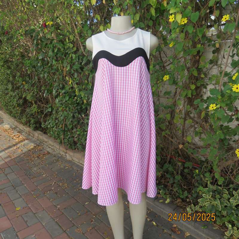Unique pink-white nylon-rayon blend check wide A-line dress with black-white yoke. Size 36
