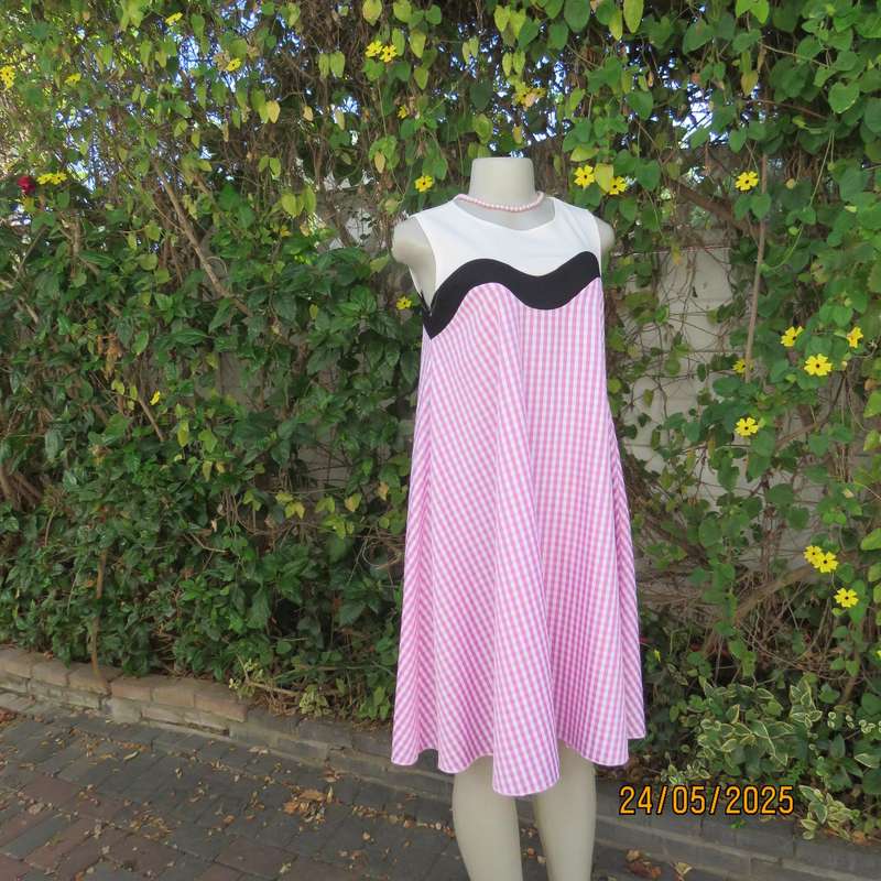 Unique pink-white nylon-rayon blend check wide A-line dress with black-white yoke. Size 36
