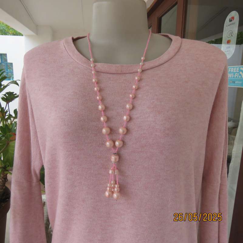 Blush pink warm oversized size 38 slip over poly knit slip over top.