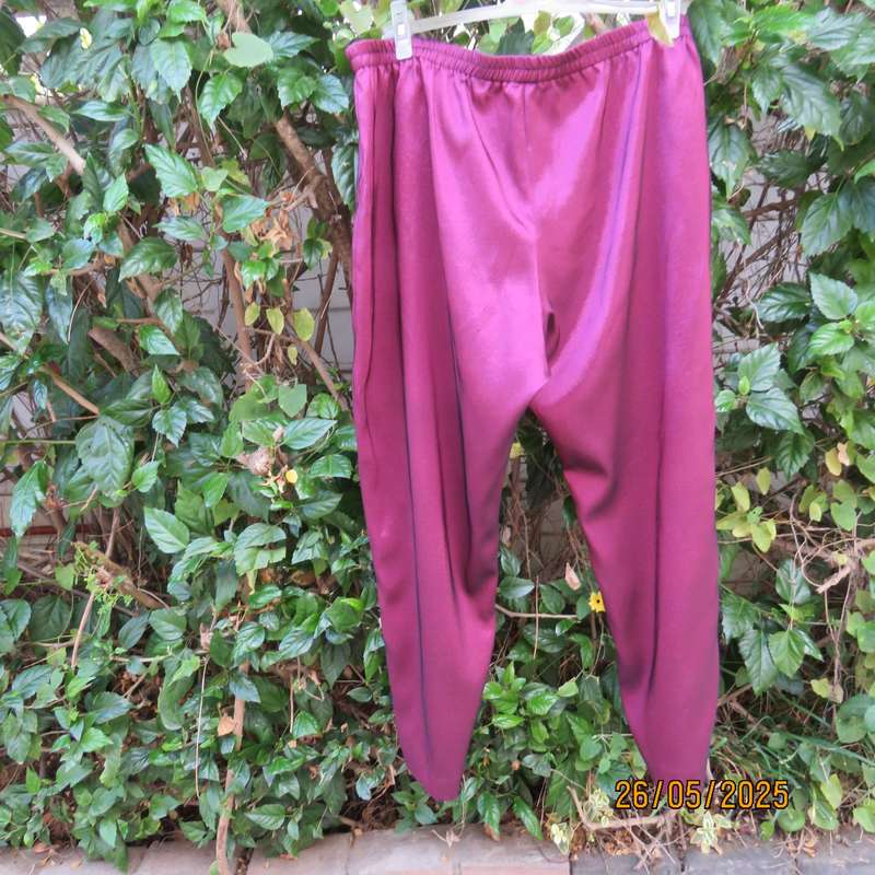 Mulberry colour boutique made shiny silky polyester size 48 pants. As new