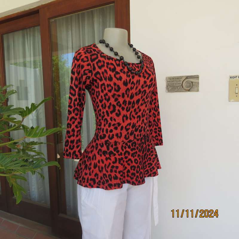AQARA  pretty red and black animal print peplum style slip over top. Size 32. As new.