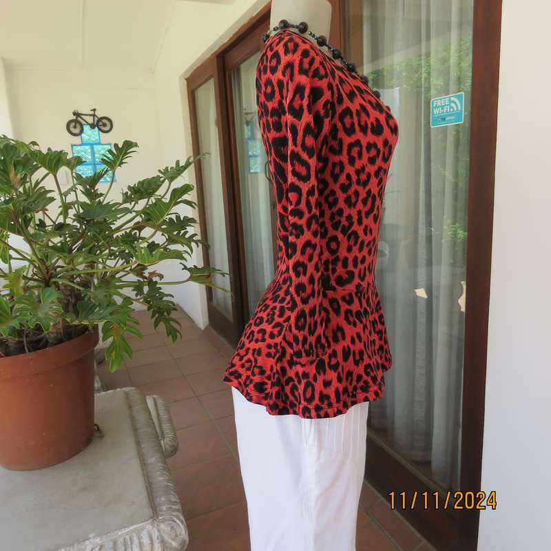 AQARA  pretty red and black animal print peplum style slip over top. Size 32. As new.