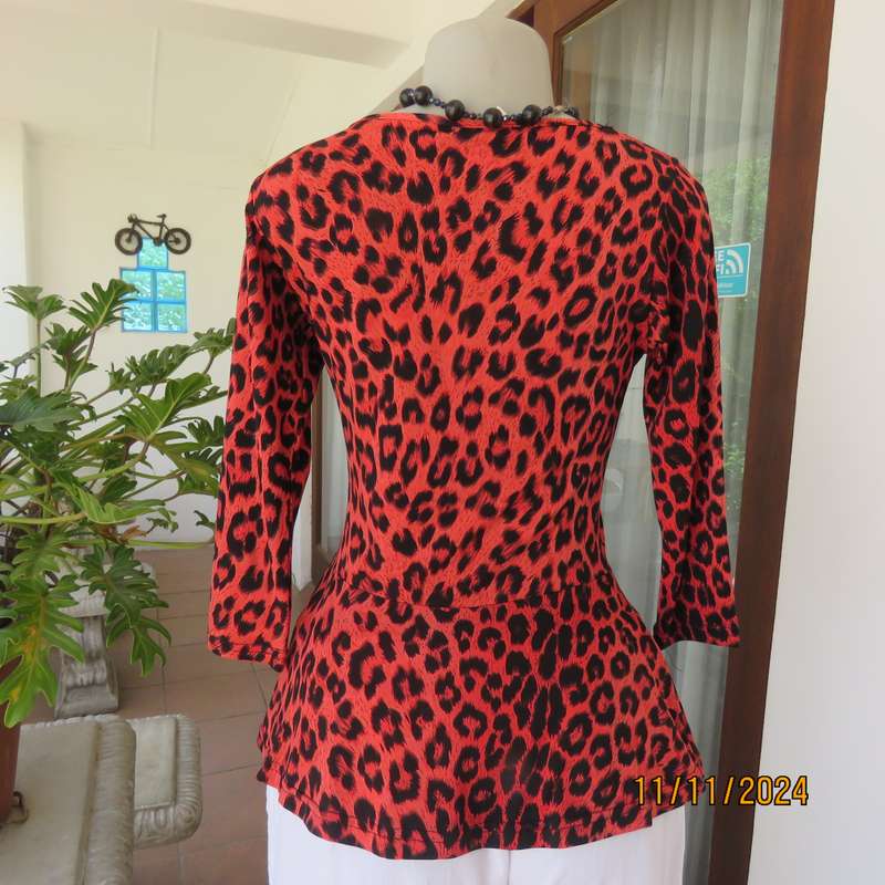 AQARA  pretty red and black animal print peplum style slip over top. Size 32. As new.