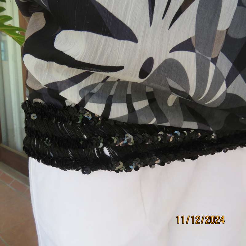 Smart halter neck top by ZIXA size 38 in black-grey-white floral poly-georgette. Black sequin band.
