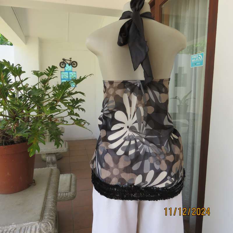 Smart halter neck top by ZIXA size 38 in black-grey-white floral poly-georgette. Black sequin band.