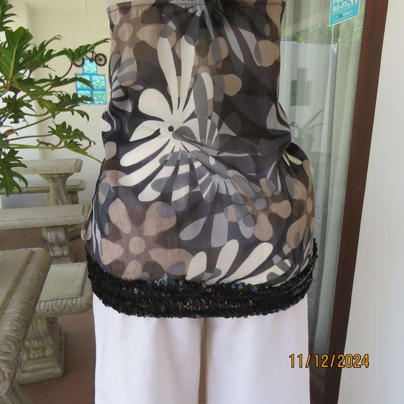 Smart halter neck top by ZIXA size 38 in black-grey-white floral poly-georgette. Black sequin band.