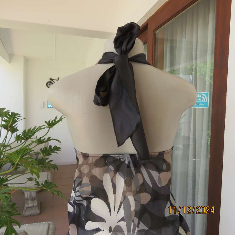Smart halter neck top by ZIXA size 38 in black-grey-white floral poly-georgette. Black sequin band.