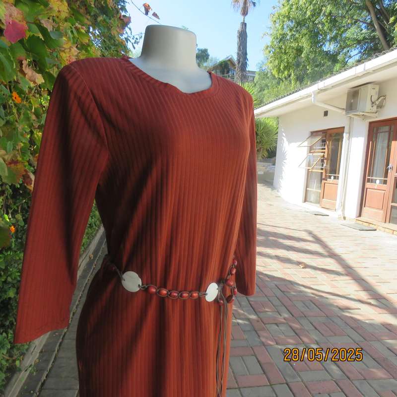 Dark burnt orange long sleeve slip over shift dress in stretch polyester size 36 with belt.