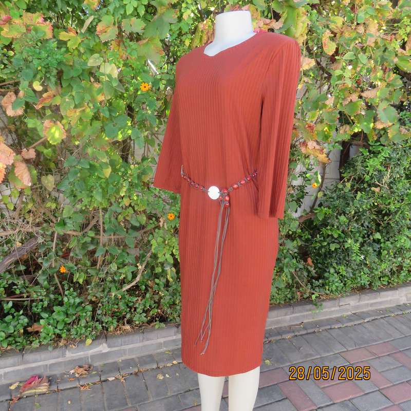 Dark burnt orange long sleeve slip over shift dress in stretch polyester size 36 with belt.