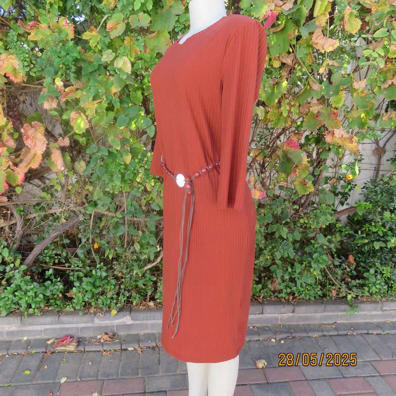 Dark burnt orange long sleeve slip over shift dress in stretch polyester size 36 with belt.