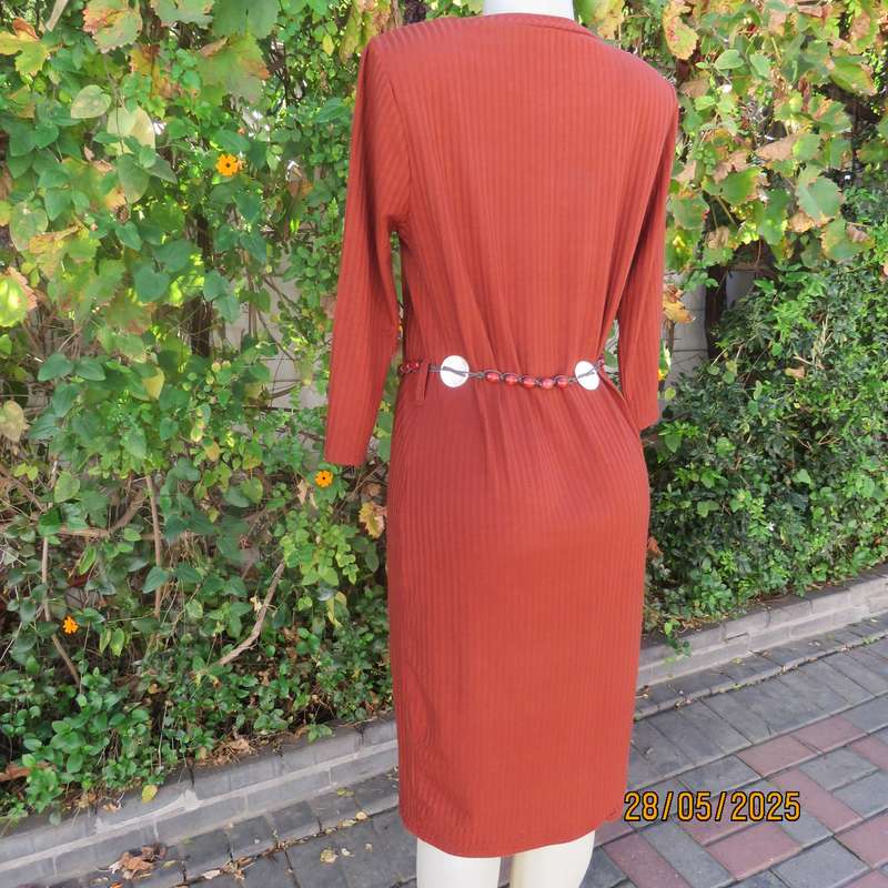 Dark burnt orange long sleeve slip over shift dress in stretch polyester size 36 with belt.
