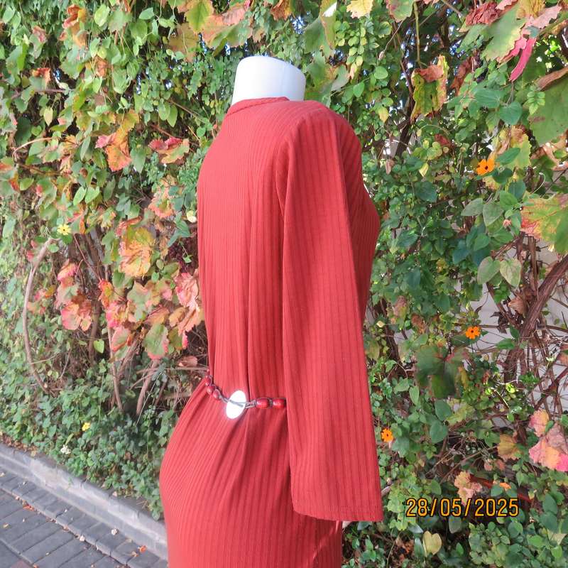 Dark burnt orange long sleeve slip over shift dress in stretch polyester size 36 with belt.