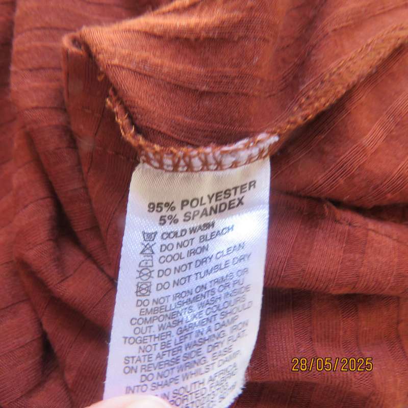 Dark burnt orange long sleeve slip over shift dress in stretch polyester size 36 with belt.