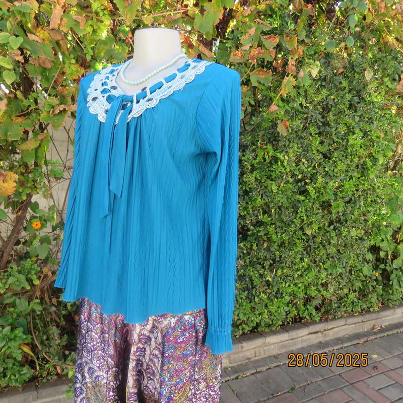Jade loose hanging long sleeve slip over permanent vertical patterned size 36-38 top.