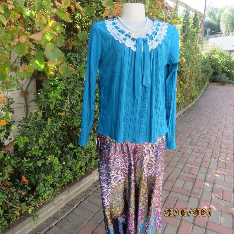 Jade loose hanging long sleeve slip over permanent vertical patterned size 36-38 top.