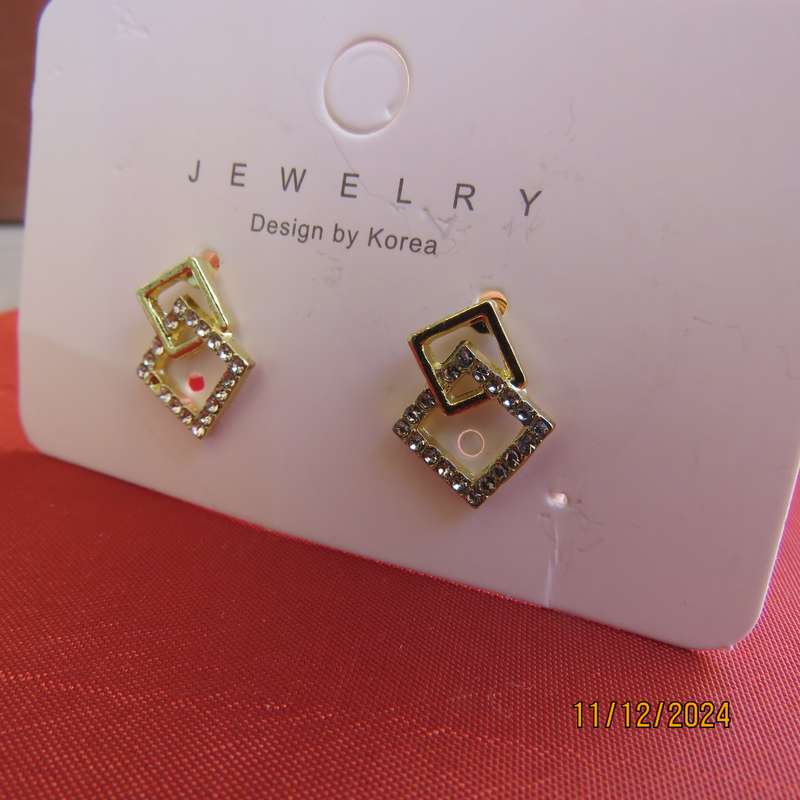 Tiny little gold square earrings with faux diamond stones. Glam factor. New item