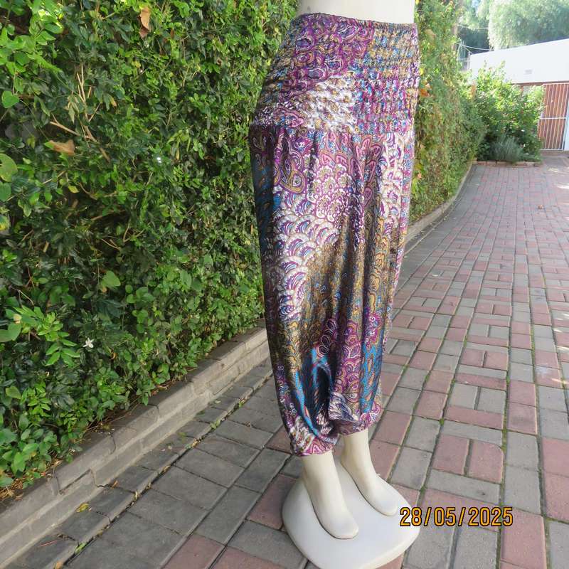 Harem pants in jewel colours with peacock feather patterns. Silky poly-rayon. Size 34-36.