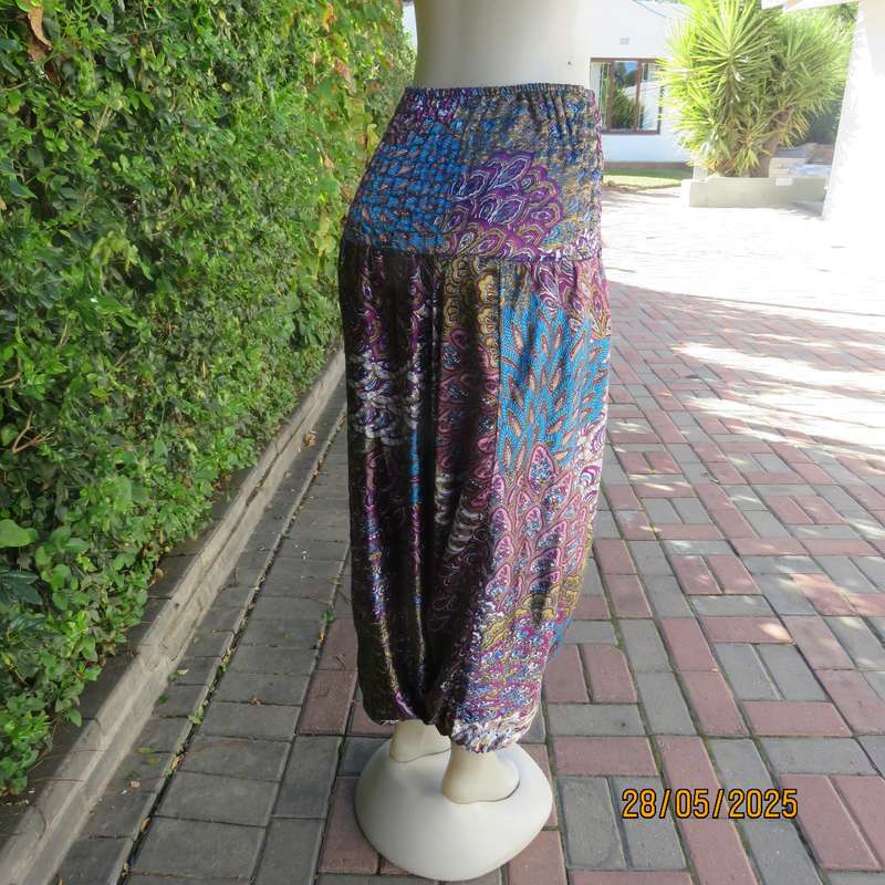 Harem pants in jewel colours with peacock feather patterns. Silky poly-rayon. Size 34-36.