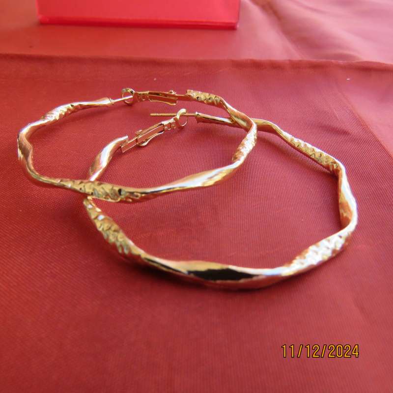Pair of golden hoop earrings with curls and decoration. Diam. 5cm. New item.