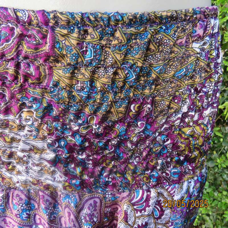Harem pants in jewel colours with peacock feather patterns. Silky poly-rayon. Size 34-36.