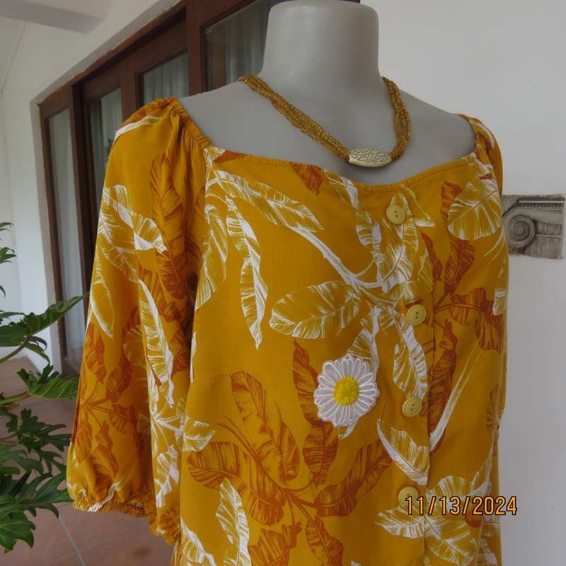 Summertime chic mustard with white-rust leaf design slip over top. Size 42 by RED. Off the shoulder