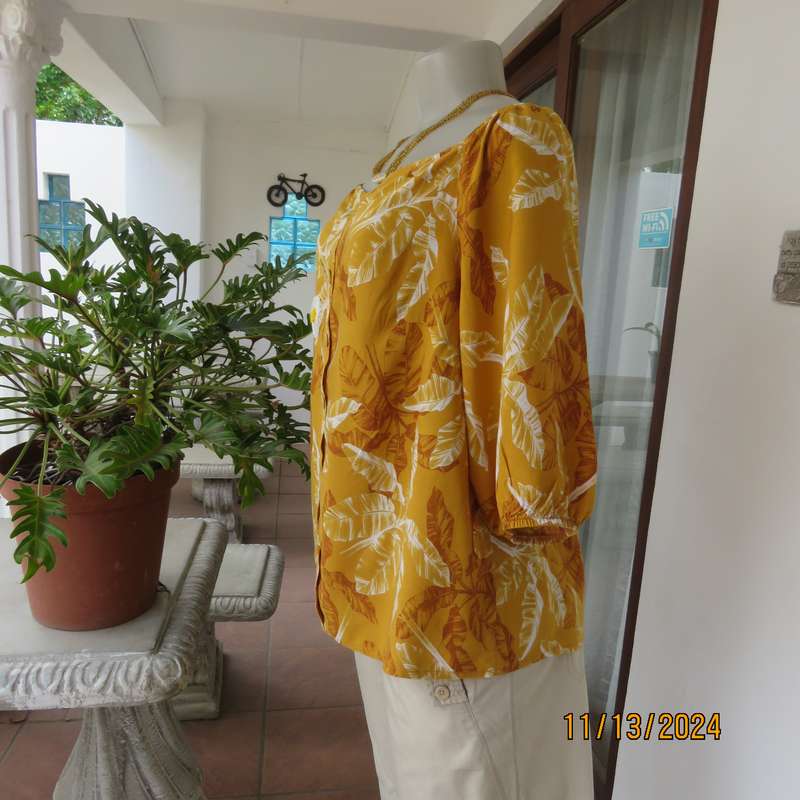 Summertime chic mustard with white-rust leaf design slip over top. Size 42 by RED. Off the shoulder