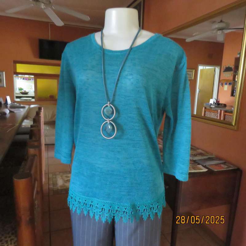 Jade green slip over textured polyester top with lace seam decoration. Size 36.