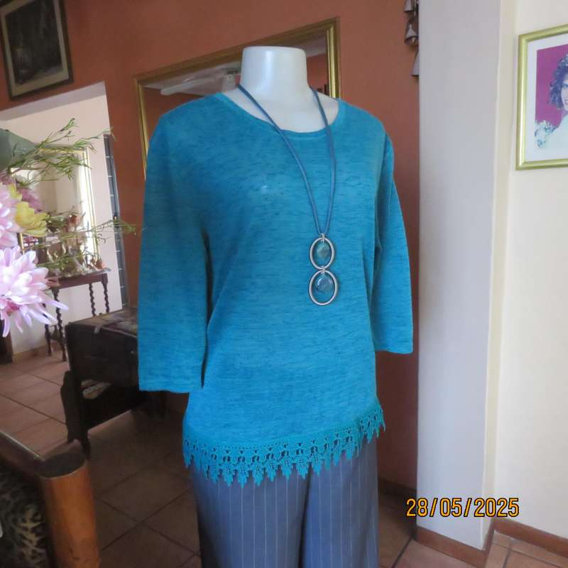 Jade green slip over textured polyester top with lace seam decoration. Size 36.