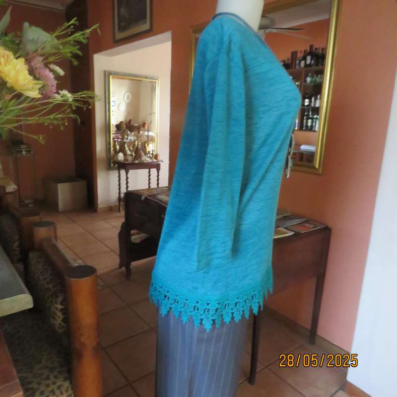 Jade green slip over textured polyester top with lace seam decoration. Size 36.