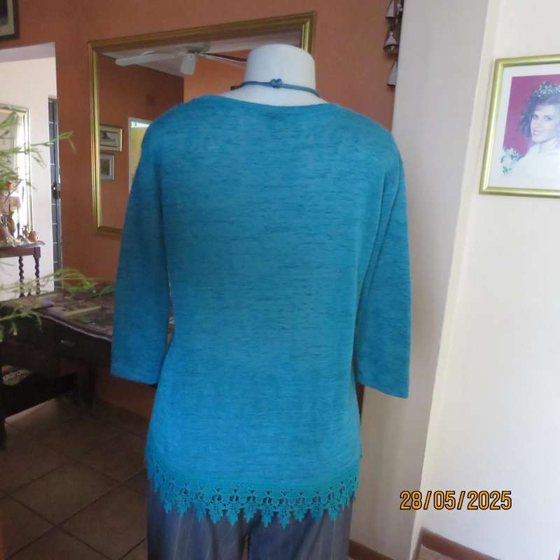 Jade green slip over textured polyester top with lace seam decoration. Size 36.