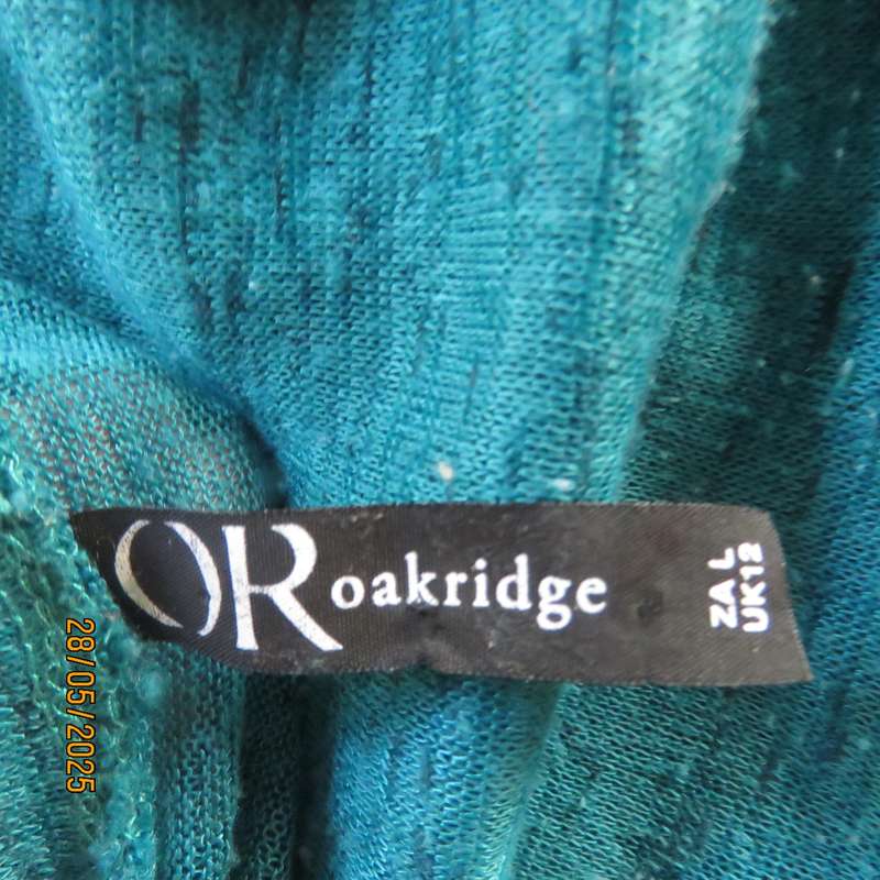 Jade green slip over textured polyester top with lace seam decoration. Size 36.