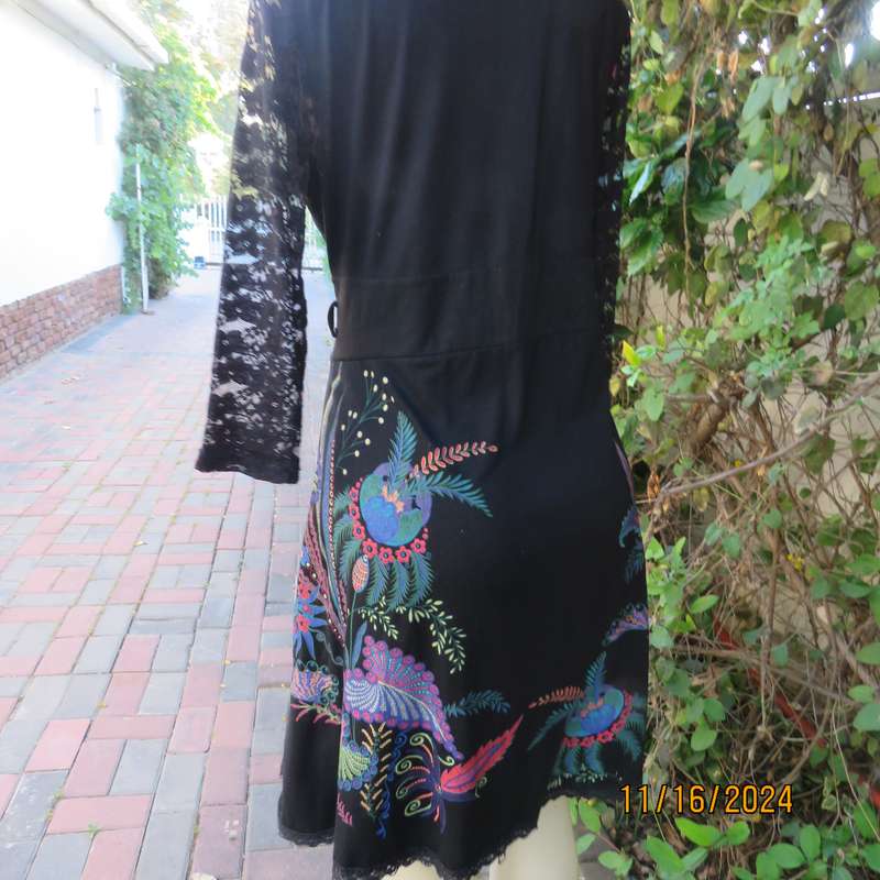 Smart casual black stretch polycotton slip over dress. Lace sleeves. Size 36-38. Jewel colour print.