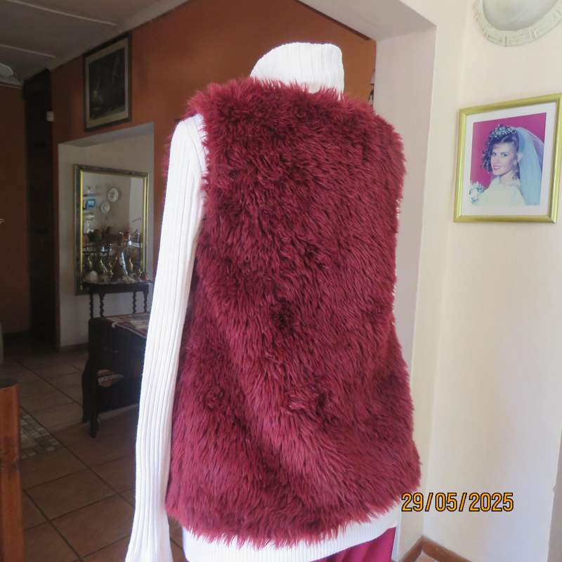 Burgundy faux fur polyester waistcoat with lining. Size 30 to 32. As new
